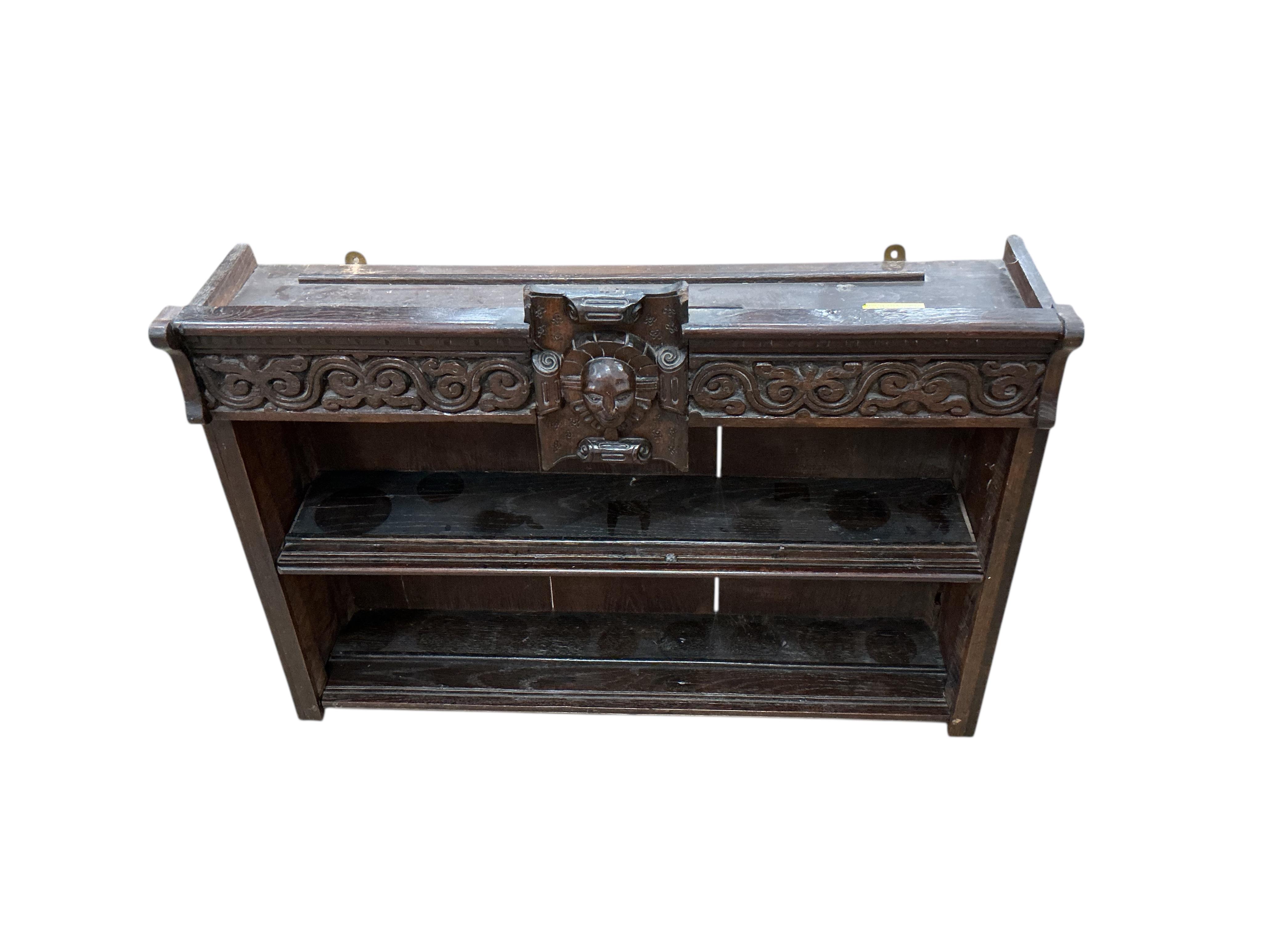 An 18th century style carved oak wall bracket, width 88cm, depth 22cm, height 66cm